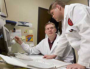 Aguilera, left, is helping graduate student Robert Layton