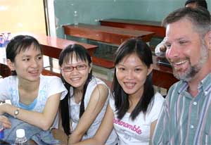 Christopher Trobridge, TTU graduate student in history, visits with students at the University of Social Sciences and Humanities, Vietnam National University Ho Chi Minh City.