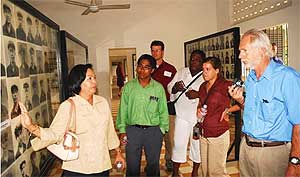 Dr. Ron Milam (far right) and others from the TTU delegation listen intently as Ms. Sopphea, their guide at Toul Sleng Prison, discusses the horrific atrocities that took place there. Ms. Sopphea lost her entire family – both parents and all siblings – to the Khmer Rouge genocide.